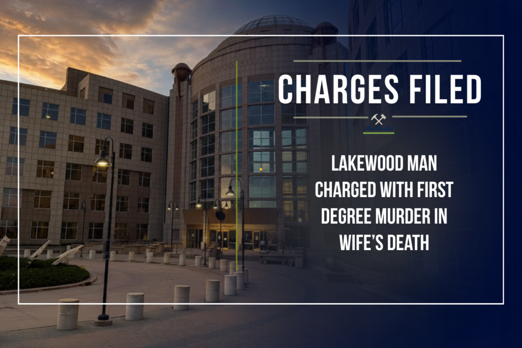 Graphic announcing criminal charges by the First Judicial District Attorney's Office. The background shows the Jefferson County Administration and Courts Building at dusk with a dark navy gradient overlay. At the top, the headline reads "Charges Filed."
