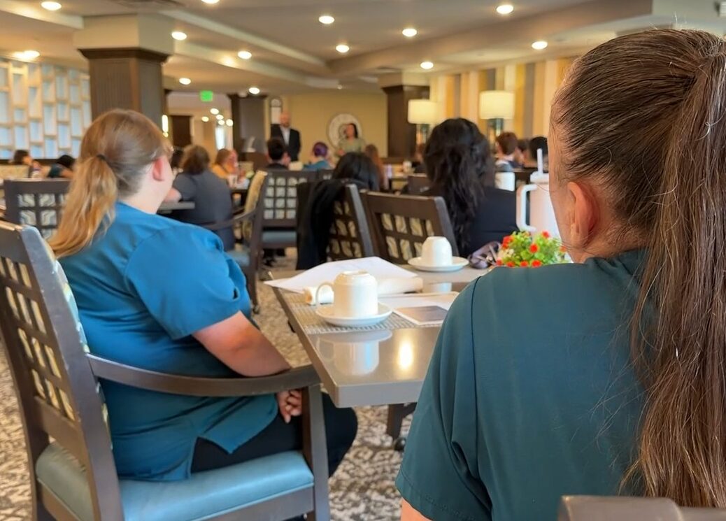 Care providers listening to a presentation